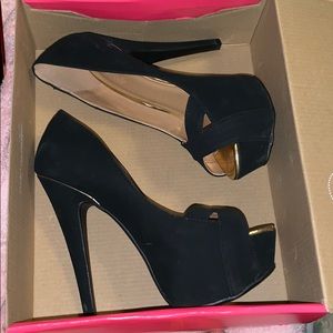 Black stiletto high heels with gold trim